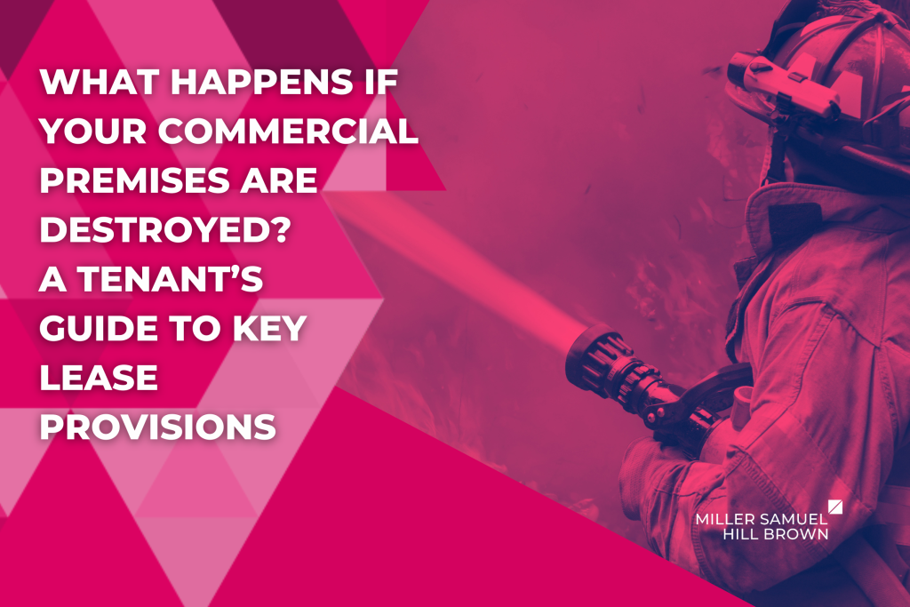 A firefighter in full gear sprays water from a hose onto flames amidst smoke.